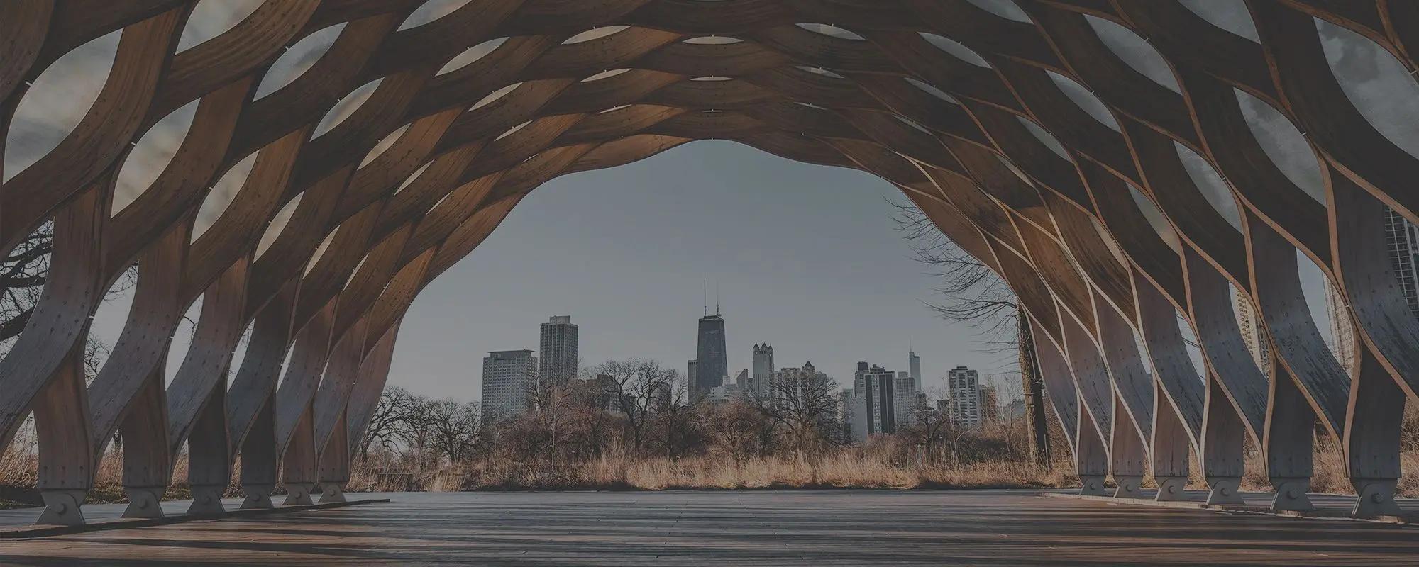 City skyline framed by architectural wooden lattice